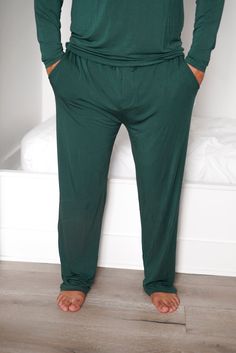 Cuddle up in comfort with these Evergreen Men's Dream Pant! These mens pajama pants are made of super soft bamboo fabric, so you'll be as snug as a bug in a rug. Plus, you can match your fam with our matching Evergreen Rib collection. Sweet dreams! Made from the softest and most breathable seasonal bamboo viscose material, you won't want to take this off! Relax, sleep and cozy up with the family in our men’s relaxed fit pants. **This listing is for the Men's Dream Pant only.** Green Long Pants For Lounging, Green Relaxed Fit Comfortable Sleepwear, Green Comfortable Sleepwear With Relaxed Fit, Comfortable Green Sleepwear For Home, Comfortable Green Lounge Bottoms, Comfortable Green Lounging Bottoms, Comfortable Green Bottoms For Relaxation, Green Sleep Bottoms With Elastic Waistband, Green Lounging Bottoms With Pockets