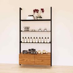 a shelf filled with lots of bottles and jars