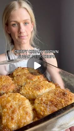 a woman holding a pan full of food in front of her face with the caption crispy creamy brown sugar pork chops