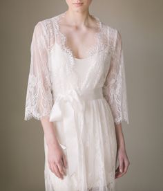 Bridal lace robe kimono with romantic Chantilly lace Length: 90cm / 35in Loose-fitting Bell sleeves Silky ribbon belt Scalloped neckline, lace cuffs and hemline Luxury Lace Trim Robe For Daywear, Luxury Lace Trim Nightgown For Wedding, Luxury Elegant Robe With Lace Trim, Luxury Lace Trim Wedding Nightgown, Lace Sleeve Robe, Lace Robe Dress, Luxury Wedding Night Gown With Lace Sleeves, Luxury White Wedding Night Gown, Luxury Vintage Wedding Kimono