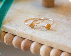 Our dainty birthstone ring features a natural Citrine gemstone in a 14k gold-filled or sterling silver setting. Citrine is the birthstone for those born in November. …………………………………. DETAILS GOLD VERSION: •STONE Citrine measuring 5mm•BAND is 14k Gold Filled or .935 Argentium Silver •WATERPROOF and can be worn all-day •SIZE INCLUSIVE and made to order Don't know your ring size? Ring Size Guide or Buy Ring Sizer