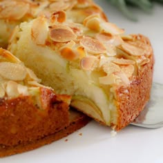 a close up of a cake on a plate with a slice taken out of it