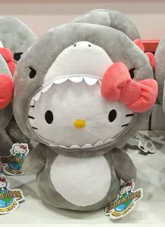 hello kitty stuffed animals are on display in a store