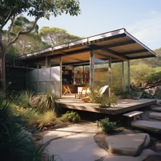 a house with a covered patio and steps leading up to it