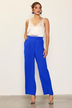 Wide-leg trousers are a staple in any season, but the pop color makes this pair especially fun. These tailored pants sit high on the waist, designed with an extended waist tab, a pleated front, and streamlined pockets. An elasticized back waistband makes for an extra-comfortable fit. •Long Pants •Elasticized waist •Double-tiered pleat •Laser-cut hems Item Number: 74266