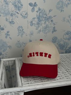 The RA Darlin' Trucker is a modern take on the classic trucker hat. Designed after Rylee's iconic red darlin tattoo and the popular upside down Dallas hat worn by Post Malone, this hat is sure to turn heads. The high-quality puff embroidery adds a special touch, ensuring durability for a lifetime of wear. Perfect for those looking for a unique and stylish accessory. Retro Snapback Hat For Baseball Season, Retro Snapback Cap, Retro Snapback Hat With Curved Brim, Trendy Red Adjustable Dad Hat, Retro Snapback Hat, Red Retro Trucker Hat With Short Brim, Retro Red Trucker Baseball Cap, Retro Snapback Hat With Letter Print, Retro Red Snapback Trucker Hat