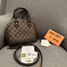 Authentic Lv Alma Bb( No Date Code, Microchip) Damier Ebene Coated Canvas Smooth Cowhide-Leather Trim Textile Lining Gold-Color Hardware Double Zip Closure Padlock Key Bell Inside Flat Pocket 4 Protective Metal Bottom Studs All Sale Final No Return Refund Or Exchange All My Items Are Authentic Alba Bb Louis Vuitton, Louis Vuitton Fanny Pack, Alma Bb Louis Vuitton, Louis Vuitton Neo Alma Bb, Louis Vuitton Handbags Crossbody, Lv Alma Bb Damier, Lv Alma Bb, Lv Alma Bb Monogram, Louis Vuitton Favorite Mm