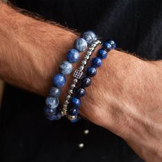 Embark on a journey of luck with our Nassau bracelet stack! The sophisticated Nassau stack features a trifecta of beaded delights - Blue Tiger Eye, Silver Glitz, and Dumortierite - creating an alluring trifecta of good fortune and charm. Indulging the adventurous spirit and wandering heart that lives within all of us, our men's bracelet stacks have been crafted to provide a touch of class to your wardrobe throughout the year. Each exquistely curated stack includes a mix of spiritually healing ge Men's Beaded Bracelets Handmade, Elegant Hand-strung Sapphire Bracelets, Elegant Sapphire Colored Hand-strung Beaded Bracelets, Luxury Beaded Bracelets With Natural Stones, Luxury Blue Round Bead Bracelets, Elegant Blue Stackable Beaded Bracelets, Luxury Blue Bracelets With Natural Stones, Luxury Blue Bracelet With Natural Stones, Luxury Blue Beaded Bracelets