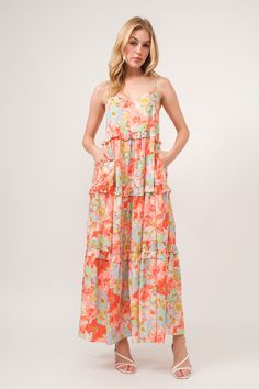 The floral ruffled tiered maxi cami dress is a stunning and feminine choice for any special occasion. With its floral print and tiered design, this dress exudes elegance and romance. The ruffled tiers add movement and depth to the dress, creating a whimsical and ethereal look. Perfect for weddings, parties, or summer outings, this dress is both beautiful and versatile. Embrace your romantic side and shine in the floral ruffled tiered maxi cami dress for a captivating and elegant ensemble. Elevat