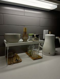 a kitchen counter with various items on it