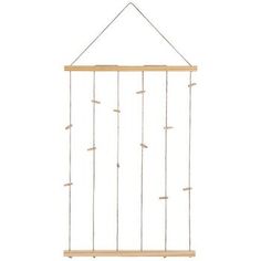 a wooden frame hanging from the side of a white wall with strings attached to it