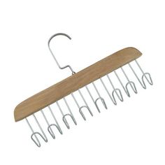 a wooden and metal comb hanging from a hook