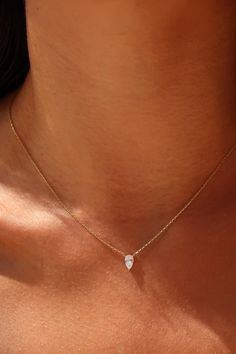 This stunning 14K Yellow Gold Necklace features a delicate pear-shaped pendant, offering a minimalist yet elegant design. A perfect diamond alternative, it's a timeless piece that complements any outfit. Ideal for women who appreciate understated luxury, making it a thoughtful gift for any special occasion ● 𝗜𝘁𝗲𝗺 𝗗𝗲𝘁𝗮𝗶𝗹𝘀 ● → Gold Kt: 14K → Available Gold Color: Rose Gold, Yellow Gold, White Gold →Cubic zirconia Cut type: Pear →Chain Length :18 Inches RETURNS & EXCHANGE POLICY Contact Pear Diamond Necklace, Pear Shaped Diamond Necklace, Pear Shape Pendant, Pear Shaped Pendant, Pear Pendant, 14k Yellow Gold Necklace, Diamond Alternatives, Necklace Delicate, Yellow Gold Necklace