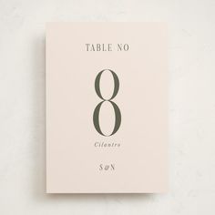 the table number 8 is displayed on a white surface with grey lettering and numbers in black