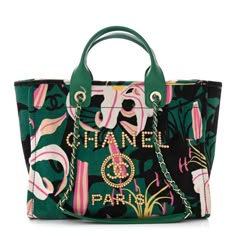 This is an authentic CHANEL Velvet Calfskin Beaded Small Deauville Tote in Pink, Green, and Black. This tote is crafted of velvet with a tropical print and a wooden beaded Chanel advertisement logo on the front. The bag features green rolled leather top handles and light gold chain-link leather threaded shoulder straps. The wide top is open to a green fabric interior with zipper and patch pockets. Small Fabric Bags, Tote Bag Chanel, Chanel Advertisement, Types Of Purses, Chic Crossbody Bag, Luxury Magazine, Fabric Handbags, Girly Bags, Handbag Heaven