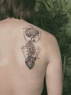 a woman with a tattoo on her back