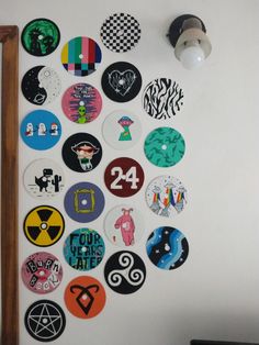 a white wall covered in lots of different colored stickers