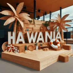 a wooden sign that says havania on the side of a building with palm trees and an inflatable life preserver