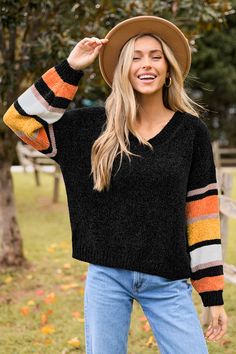 Get festive with the Black V-Neck Long Sleeve Candy Corn Sweater! Featuring a classic black body and striped sleeves that mimic the vibrant colors of candy corn, this sweater is perfect for adding a playful touch to your fall wardrobe. Featured Line: SEA Product code: CAA06A4J152RK Features:  Knit V-neckline Long sleeve Pattern: GEO Wash Method: Regular Wash Material: 100%ACRYLIC. Striped Sleeve, Sleeve Pattern, Black Body, Candy Corn, Sleeves Pattern, Fall Wardrobe, Classic Black, Have Fun, Corn