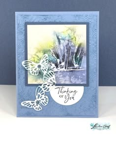 a blue card with butterflies on it and the words thinking is you written in white