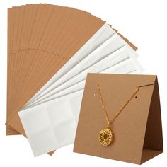 PRICES MAY VARY. HIGH QUALITY - Our Earring Display Cards are made of high quality paper material with pre-cut holes and pre-scored which are very easy to use. SIZE - Each standing earring card measures 8.5 x 5 x 8.5 cm/3.4 x 2 x 3.4 Inch. UNIQUE DESIGN - These display cards are the perfect gift for anyone who needs to display their earrings and necklace vertically. They stand securely on the table without the use of a display stand. EASY TO OPERATE - Each earring card is pre-scored so it's easy Packaging For Small Business, Earring Packaging, Small Business Jewelry, Necklace Pouch, Earring Display Cards, Business Jewelry, Jewelry Cards, Jewelry Display Cards, Necklace Packaging