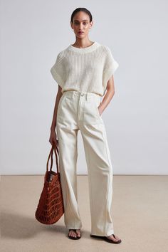 100% Linen Made in China Wide crewneck collar, drop shoulder, ribbed details throughout Dry clean only Easy fit. Select your usual size Model is 5'10" and wearing a size XS/S Clothing Capsule, Summer Knits, Linen Vest, Cardigan Knitted, Apiece Apart, Elevated Basics, Knitted Vest, Color Inspo, Knitted Cardigan