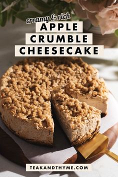 an apple crumble cheesecake on a plate with a piece cut out and the title above it