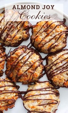 almond joy cookies on a plate with chocolate drizzled over them and coconut flakes