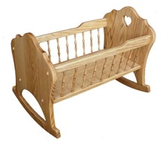 a wooden cradle for a baby to sit on