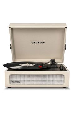 the crosley record player is open and ready to play