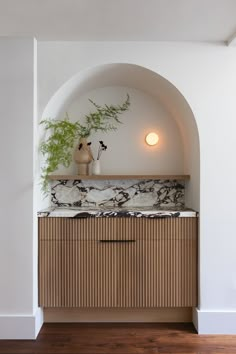 a plant is sitting on top of a cabinet