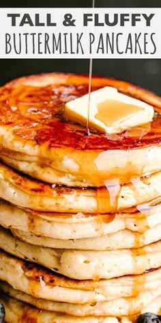 stack of pancakes with butter and blueberries on the side that says tall & fluffy buttermik pancakes