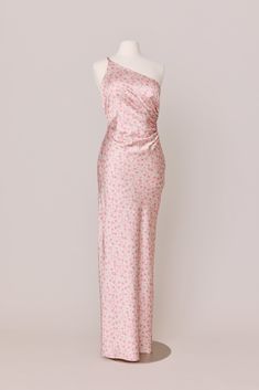 a pink and white dress on a mannequin