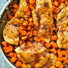 chicken, carrots and potatoes in a pan