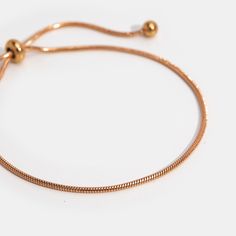 Simple, elegant, and perfect for day or night. This stunning bracelet is guaranteed to be an everyday essential for years to come. Made with waterproof titanium steel, you never need to worry about fading or tarnishing jewelry ever again! Waterproof & tarnish-free Titanium steel Gold or rose-gold plated Slide knot closure Hypoallergenic, lead & nickel free If you aren't in LOVE with your purchase, please let us know within 30 days of receiving your item, and you'll receive a stress-free refund. Adjustable Modern Snake Chain Bracelet, Modern Adjustable Snake Chain Bracelet, Modern Adjustable Rose Gold Bracelets, Adjustable Tarnish Resistant Metal Bracelet, Adjustable Jubilee Snake Chain Bracelet, Minimalist Flexible Bracelets For Gifts, Classic Adjustable Rose Gold Charm Bracelet, Adjustable Rose Gold Chain Bracelet For Everyday, Adjustable Metal Chain Bracelet, Tarnish Resistant