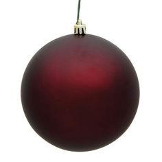 a red ornament hanging from a silver ball on a white background with clippings