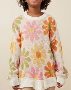 Girls Retro Daisy Knit Pullover Sweater. Style GY7433. Ready to ship! Features: Knit Sweater Long Sleeve Pull On Silhouette Material & Care: 100% Acrylic Hand Wash Cold Hang Dry Casual White Knitting Pattern For Fall, White Casual Knitting Pattern For Fall, Playful Knitted Sweater For Spring, Playful Spring Knitted Sweater, Playful Knitted Spring Sweater, Cute Oversized Sweater For Spring, Playful Knitted Tops For Spring, Chunky Knit Acrylic Tops For Spring, Cute Crochet Sweater For Spring