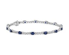 This sapphire and diamond bracelet combines classic tennis bracelet style with a colorful blue hue. Deep blue oval-cut sapphires alternate with round-brilliant cut diamonds in an alternating pattern that adds eye-catching interest to this jewelry box essential. Classic Sapphire Tennis Bracelet With Prong Setting, Sapphire Diamond Tennis Bracelet With Round Cut, Sapphire Diamond Tennis Bracelet With Round Shape, Sapphire Tennis Bracelet With Round Diamonds, Classic Sapphire Tennis Bracelet With Round Shape, Sapphire Tennis Bracelet With 17 Jewels, Classic Round Sapphire Diamond Bracelet, Classic Sapphire Tennis Bracelet With Brilliant Cut, Classic Sapphire Diamond Tennis Bracelet