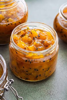 several jars filled with food sitting on top of a table