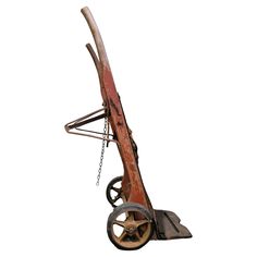 an old wooden cart with wheels and chains attached to the front wheel on a white background