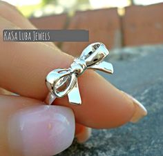 Sterling Silver Bow ring, ribbon rings, promise ring - stamped 925 - womens rings - sweet ring - cute ring *IF YOUR SIZE ISNT SHOWING, MESSAGE ME. I might be sold out and will be able to replenish shortly* LARGE RIBBON RING Top of ring height: 9.9mm Top of ring width: 17.7mm Band width: 2.2mm Shank width: 2mm Metal: 925 sterling silver Plating: rhodium plated Finish: high polish SMALL RIBBON RING Face Height: 8 mm Metal Material: Sterling Silver Finish: Oxidized Stamped 925 Nothing but the best from my custom jewelry store. Email me if you have any questions. Womens Rings, Ribbon Ring, Rings Promise, Cute Ring, Sweet Ring, Vero Beach Fl, Bow Ring, Vero Beach, Silver Bow