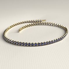 Add a breathtaking touch to your ensemble with this exquisite Tanzanite Tennis Bracelet. Skillfully handcrafted using high-quality 14K/18K gold, this custom stacking bracelet is perfect for everyday wear or special occasions. Adorned with stunning Tanzanite gemstones, this December birthstone bracelet is a must-have for any jewelry lover. It also makes a thoughtful Christmas gift that will surely impress. Don't miss out on our exclusive Cyber Sale and treat yourself or a loved one today!𝐅𝐞𝐚𝐭 Timeless Tanzanite Yellow Gold Jewelry, Formal 14k Yellow Gold Tennis Bracelet, 14k Gold Round Tennis Bracelet For Anniversary, Gold Bracelets With Prong Setting And Round Cut, Gemstone Tennis Bracelet Gift, Classic Gold Tanzanite Jewelry, Flexible Round Cut Tennis Bracelet As A Gift, Elegant Round Tanzanite Jewelry, Formal Yellow Gold Tanzanite Jewelry