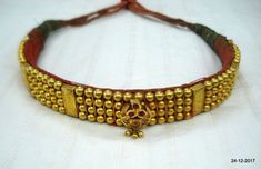 Vintage antique tribal old 22kt gold beads choker necklace from rajasthan India. Great design good for jewelry collection.Note - Gold beads are filled with wax. Please check pictures carefully for more detail.Groos weight - 73.5 gramsNet gold weight approx - 24 gramsGold beads length - 26.7 cm (10.5 inches)Gold beads width - 2 cm (0.8 inches)Length free size can be adjsut by back thread knot. Dholki Beads Necklace Gold, Thushi Necklace Gold Designs, Festival Intricate Choker Temple Necklace, Festival Temple Necklace With Intricate Design, Heavy Temple Jewelry Choker Necklace, Antique Kundan Temple Necklace For Festivals, Antique Kundan Temple Necklace For Ceremonial Use, Antique Kundan Temple Necklace For Ceremonial Occasions, Antique Kundan Necklace With Intricate Design For Festivals