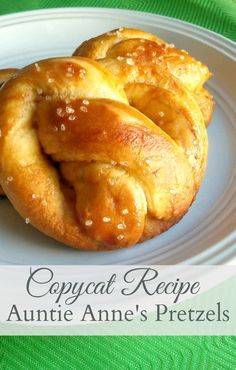 two croissants on a white plate with the words copycat recipe annie anne's pretzels