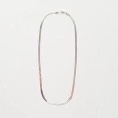 Our silver herringbone chain necklace is the ultimate maximalist piece - a timeless classic that exudes sophistication and glam. Available in two lengths so you can style it solo or double it up. -- available lengths: 16" and 18" width: 3.5mm sterling silver This shiny gal requires extra care to keep her looking her best. The chain is constructed of individually woven and flattened links so it should always be removed before bed and stored flat.