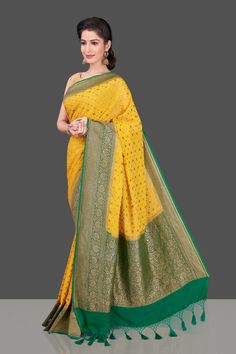 Buy beautiful yellow georgette Benarasi saree online in USA with green zari border. Shop beautiful Banarasi sarees, georgette sarees, pure muga silk sarees in USA from Pure Elegance Indian fashion boutique in USA. Get spoiled for choices with a splendid variety of Indian saris to choose from! Shop now.-full view Yellow Katan Silk Pre-draped Saree, Yellow Semi-stitched Chanderi Pre-draped Saree, Yellow Art Silk Pre-draped Saree With Zari Work, Fitted Yellow Pre-draped Saree With Pallu, Yellow Georgette Pre-draped Saree With Pallu, Yellow Georgette Pre-draped Saree With Zari Work, Yellow Fitted Georgette Pre-draped Saree, Yellow Fitted Pre-draped Saree In Georgette, Yellow Fitted Pre-draped Georgette Saree