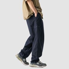 Material: 100% PolyesterFeatures: Pants, cargo pants, wide legs, slightly stretchy, drawstring waist, solid color, straight-leg, relaxed fit, unisex, couple outfits.Style: Casual, college, streetwear Baggy Cargo Pants With Cargo Pockets, Baggy Casual Cargo Pants With Pockets, Casual Wide-leg Cotton Cargo Jeans, Baggy Cargo Jeans For Outdoor Casual Wear, Wide-leg Work Pants With Cargo Pockets For Streetwear, Casual Baggy Cargo Parachute Pants, Casual Baggy Cargo Trousers, Relaxed Fit Wide Leg Cargo Sweatpants, Hip Hop Style Straight Leg Outdoor Pants