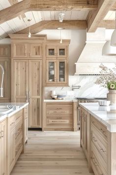 a kitchen filled with lots of wooden cabinets and counter top space next to an oven