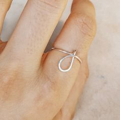 Delicate details make our Initial Ring in Silver a gorgeous addition to your finger! This beautiful piece is slim and trim, with a sweet cursive letter that lets you express yourself and to wear one on top of the other that make your look even more intriguing. This unique ring is made with gorgeous Sterling Silver for a beautiful shine that lasts. • Material: High Quality Sterling Silver 925, Gold Filled 12k, Rose Gold 12k• This ring is adjustable (you will receive it in the standard size US7, i Minimalist Ring As Spring Season Gift, Minimalist Rings As Spring Season Gifts, Minimalist Rings For Spring Gift, Minimalist Ring As Spring Gift, Minimalist Spring Rings For Gift, Minimalist Open Ring Jewelry For Spring, 14k Gold Open Initial Ring, Simple Midi Rings As Gifts, Adjustable Initial Ring For Promise