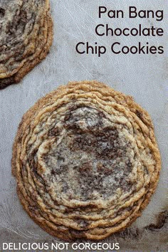 two chocolate chip cookies sitting on top of each other